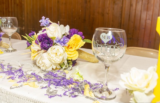 purple and yellow white wedding tablescape for fall wedding colors 2023 purple and yellow