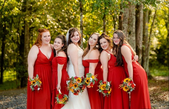 red bridesmaid dresses white bridal gown red and yellow bouquets for fall wedding colors 2023 red and yellow