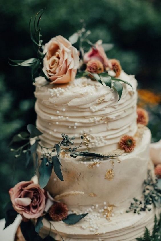wedding cake with rust colored blooms and foliage for sage green wedding colors 2023 sage green and terracotta
