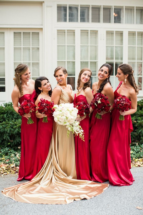 gold bridal gown and red bridesmaid dresses for red and black wedding colors red black and gold