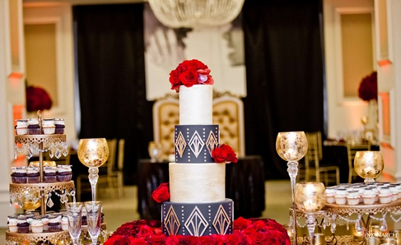 white and black wedding cake dotted with red roses for red and black wedding colors red black and gold