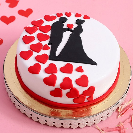 wedding cake with black couple figure and red hearts for red and black wedding colors red black and champagne