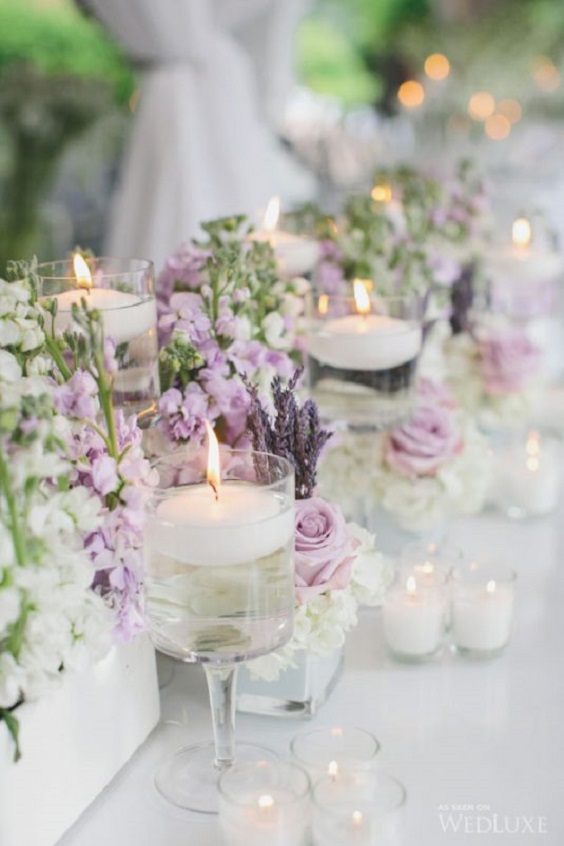 lilac flower and white candle centerpieces for purple wedding colors 2023 lilac and white