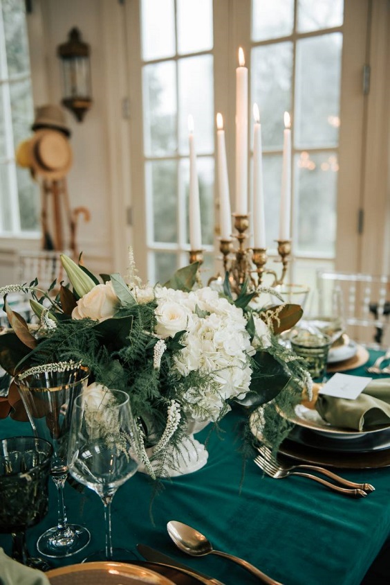emerald green tablecloth and gold tablewear for winter wedding colors 2023 emerald green and gold