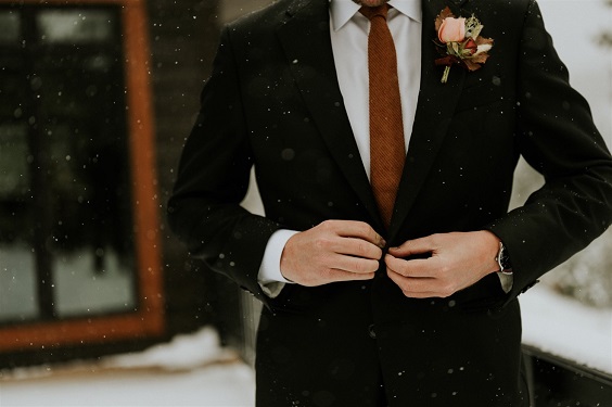 black mens suit and brown tie for winter wedding colors 2023 brown and white