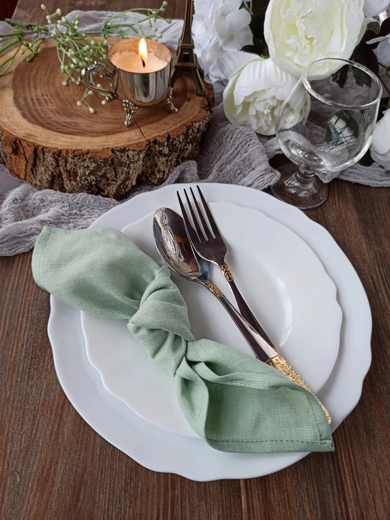 table setting for winter wedding colors 2023 sage green and gold