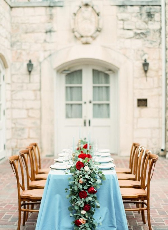 dusty blue wedding table runner and red flowers and greenery decorations for red wedding colors 2023 red and dusty blue