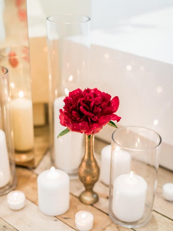 red flowers gold vase and white candles wedding centerpieces for red wedding colors 2023 red gold and white