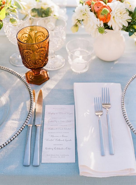 light blue wedding tablecloth and drinkware for august wedding colors 2023 light blue coral and peach