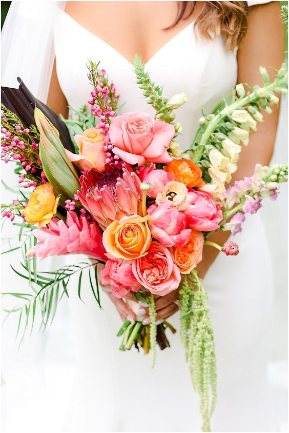orange and peach flower bridal bouquet for august wedding colors 2023 orange and royal blue