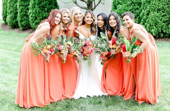 orange bridesmaid dresses and white bridal gown for august wedding colors 2023 orange and royal blue