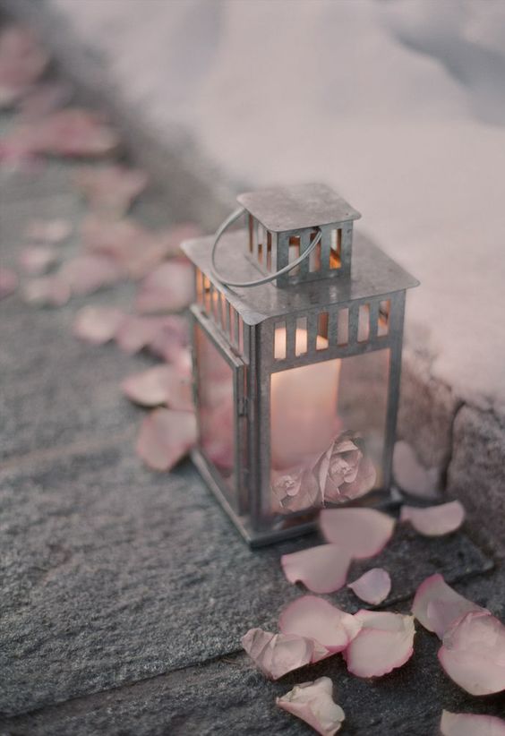 grey wedding latern and petal pink rose petals  décor  for august wedding colors 2023 shades of pink and grey