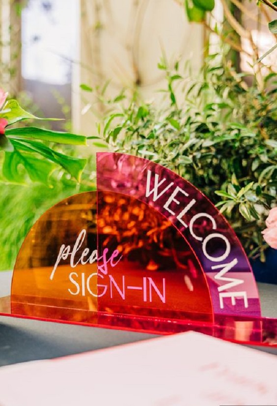 colorful wedding welcome sign-in for august wedding colors 2023 rich colors