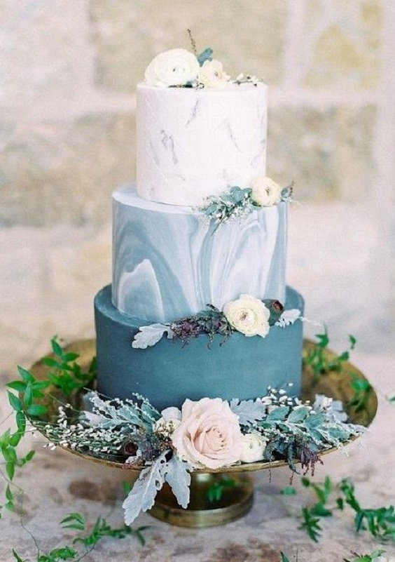 white and french blue wedding cake dotted with light pink flowers for blue wedding colors 2023 french blue and cream