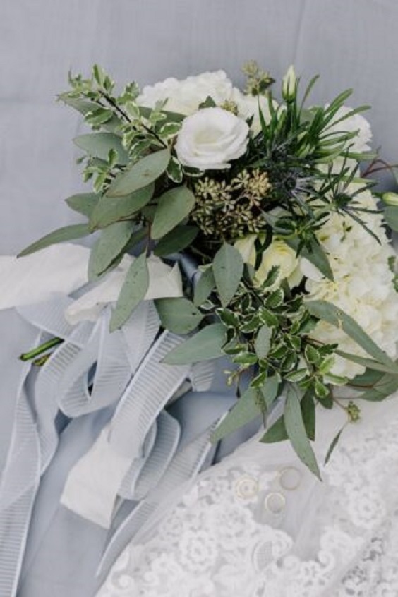 white and greenery bouquets with slate blue ribbons for blue wedding colors 2023 slate blue green and white