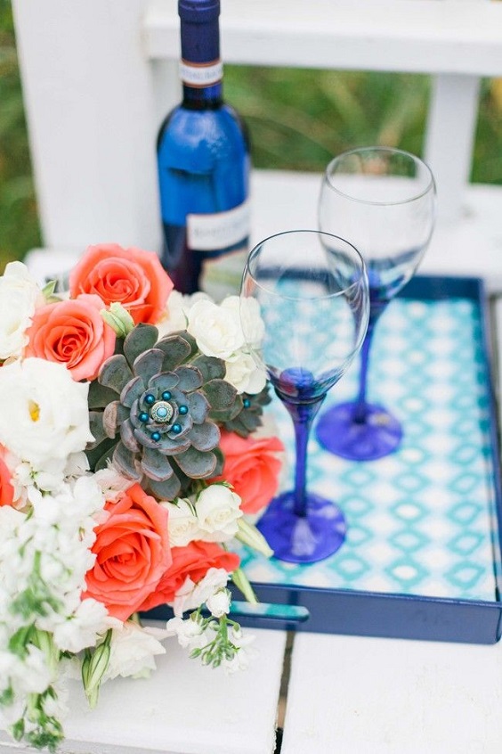 royal blue bottles and vase wedding decorations white and coral floral wedding setting for blue wedding colors 2023 royal blue and coral