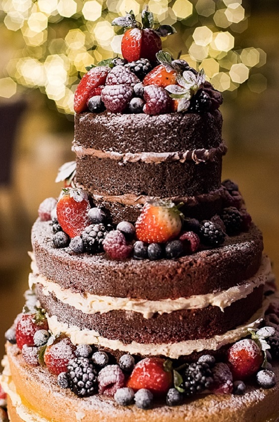 wedding cake dotted with blueberry for blue wedding colors 2023 navy blue and burgundy