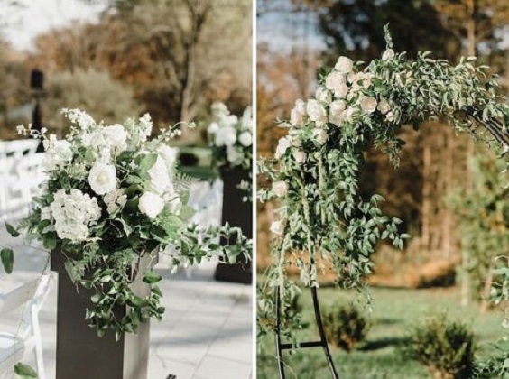 white flower and greenery decoration in wedding arch and wedding aisle for november wedding colors 2023 olive green and white