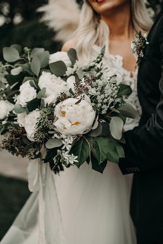 white flower and sage greenery bridal bouquet for green wedding theme 2023 sage green colors