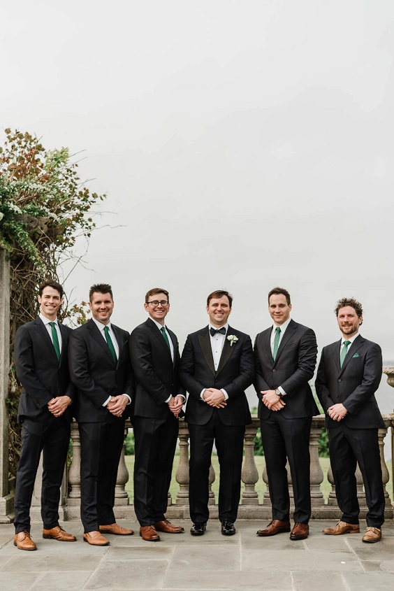 black groomsmen suits with emerald green ties and bowtie for green wedding theme 2023 emerald green colors