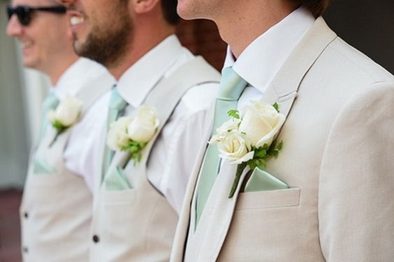 beige groomsmen suits with mint green ties and corsages for green wedding theme 2023 mint green colors