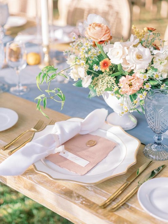 dusty blue wedding tablecloth and blush wedding plates napkins for april wedding color schemes for 2023 blush dusty blue and pale yellow