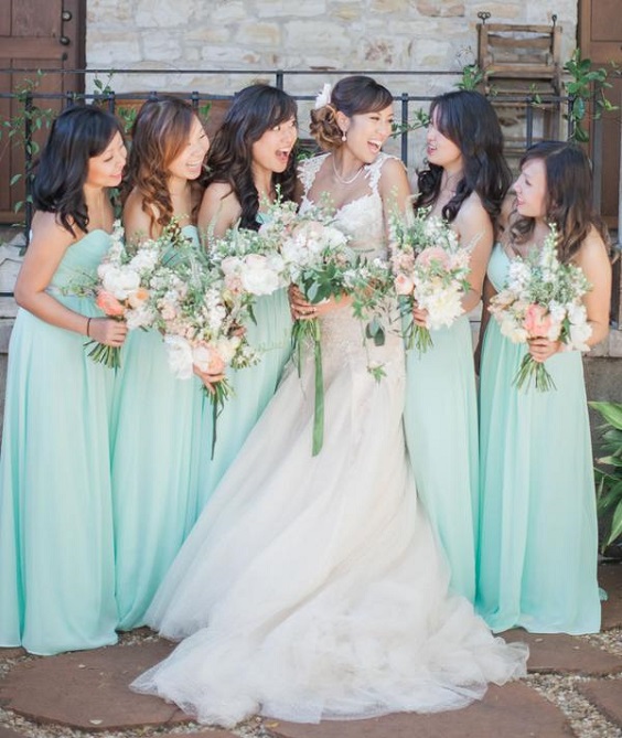 sage green bridesmaid dresses and white bridal gown for april wedding color schemes for 2023 sage and peach