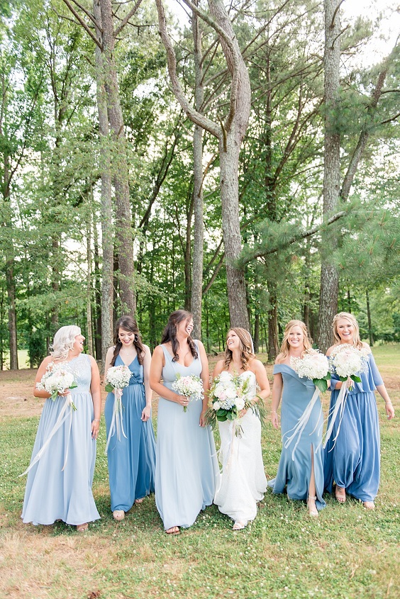 ice blue sky blue and dusty blue bridesmaid dresses white bridal gown for april wedding color schemes for 2023 shades of blue