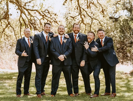 navy blue groomsmen suits terra cotta ties for april wedding color schemes for 2023 terra cotta and nude