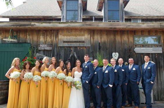 yellow bridesmaid dresses white bridal gown and navy blue groomsmen suits for yellow weddding themes for 2023 yellow and navy