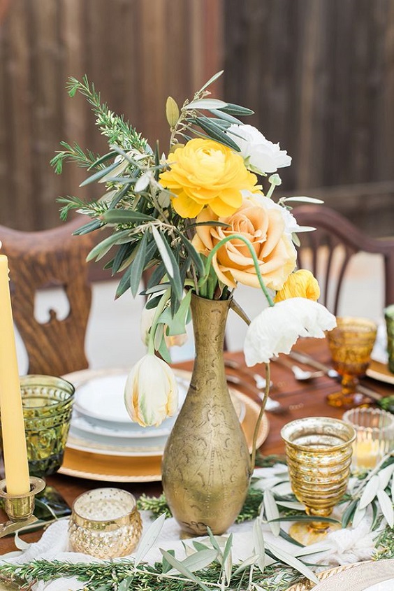 yellow flowers and greenery in gold vase for yellow weddding themes for 2023 yellow and green
