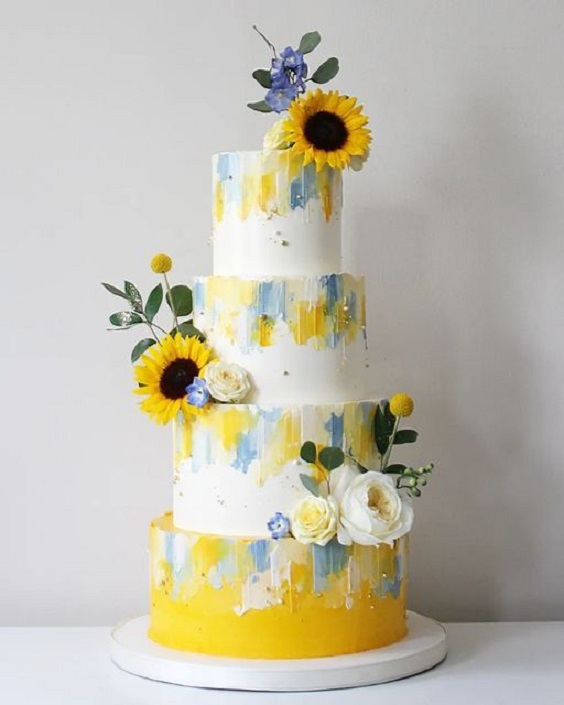 white yellow and dusty blue wedding cake dotted with sunflower for yellow weddding themes for 2023 yellow and dusty blue