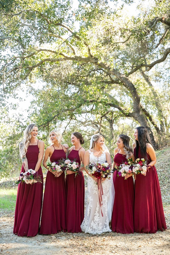 burgundy bridesmaid dresses and white bridal gown for navy blue wedding themes for 2023 navy blue and burgundy