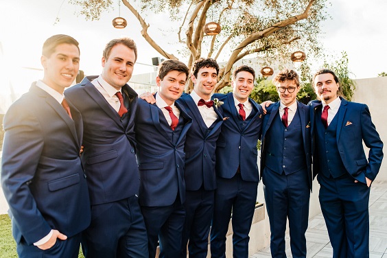 navy blue men suits and burgundy ties and bowtie for navy blue wedding themes for 2023 navy blue and burgundy