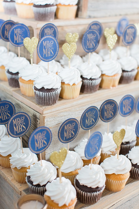 cupcakes wit dusty blue toppers for navy blue wedding themes for 2023 navy blue and dusty rose