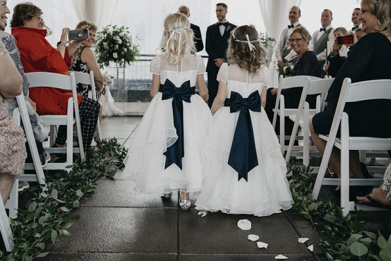 white flower girls dresses with navy blue sashes for navy blue wedding themes for 2023 navy blue and grey
