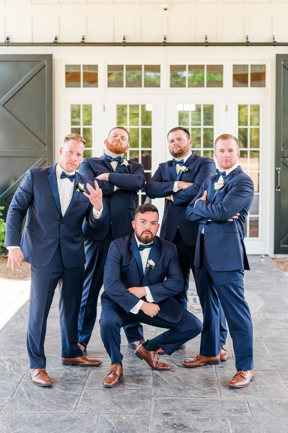 navy blue groomsmen suits and bowties for dusty blue wedding themes for 2023 dusty blue and navy blue