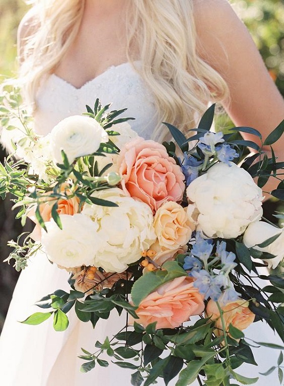 white coral and peach flower bouquet for dusty blue wedding themes for 2023 dusty blue coral and peach