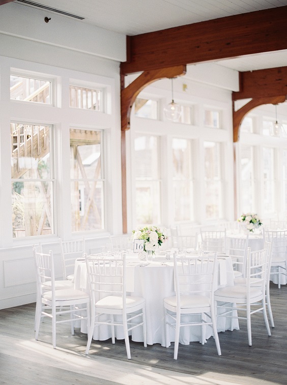 white wedding tablecloth and chairs for great summer wedding color palettes for 2024 ice blue navy and white