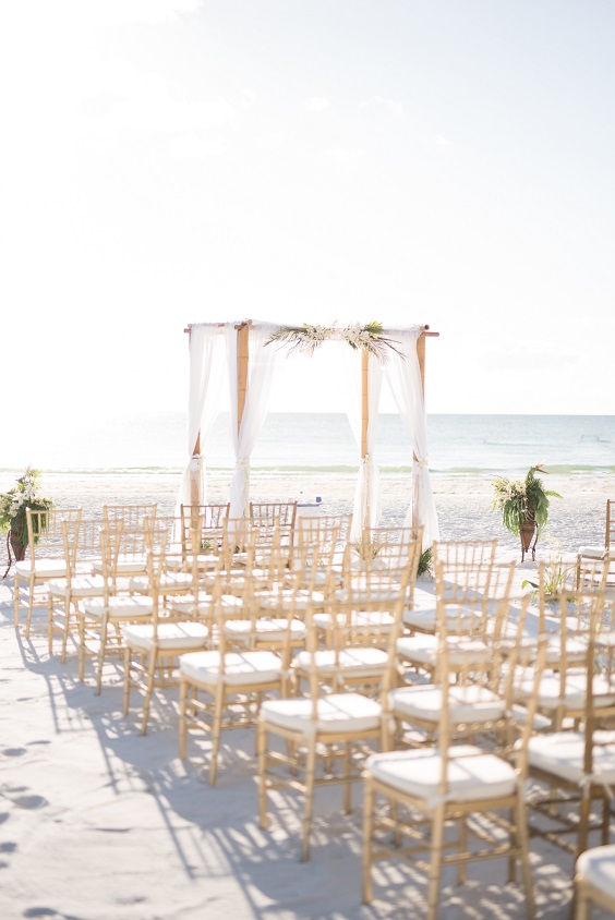 white wedding arch white and champagne wedding chairs for great summer wedding color palettes for 2024 mauve and champagne