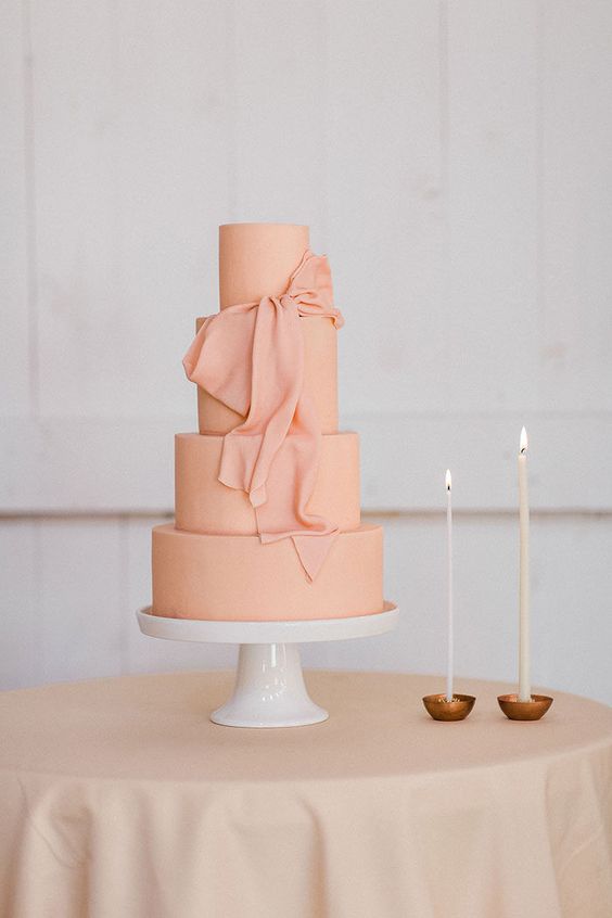 peach-creamed wedding cake for great summer wedding color palettes for 2024 peach white and green