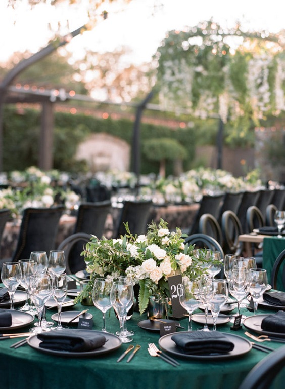 emerald green wedding tablecloth black napkins black wedding chairs for emerald green wedding color schemes for 2024 emerald green and black