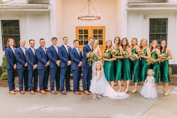 emerald green bridesmaid dresses white bridal gown navy blue groomsmen suits for emerald green wedding color schemes for 2024 emerald green and navy blue