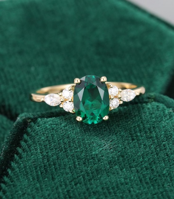 emerald wedding ring in a emerald box for emerald green wedding color schemes for 2024 emerald green and navy blue