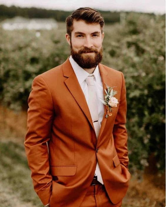 burnt orange bridegroom suit for emerald green wedding color schemes for 2024 emerald green and burnt orange