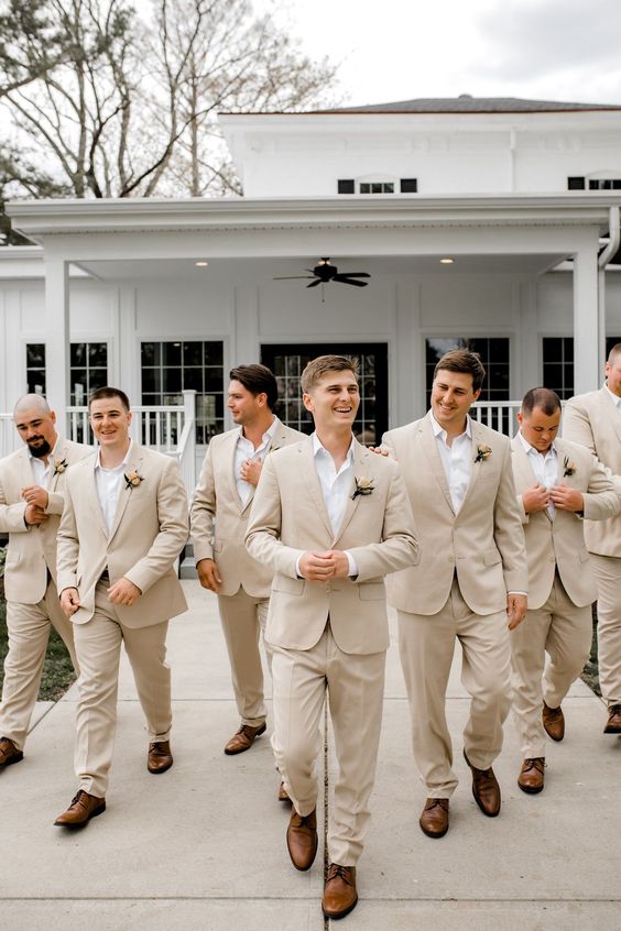 champagne bridegroom and groomsmen suits for emerald green wedding color schemes for 2024 emerald green and champagne