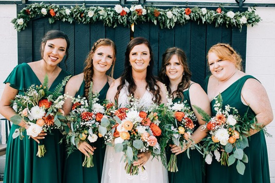 Green Boho Wedding Colors 2024, Green Bridesmaid Dresses, Orange Flowers And Sage Greenery