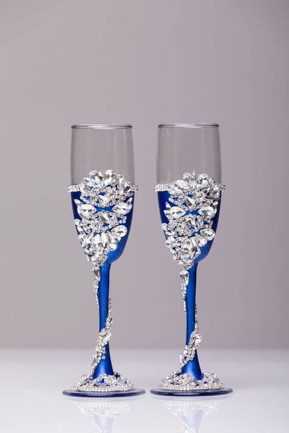 Champagne glasses for royal blue and silver metallic winter wedding