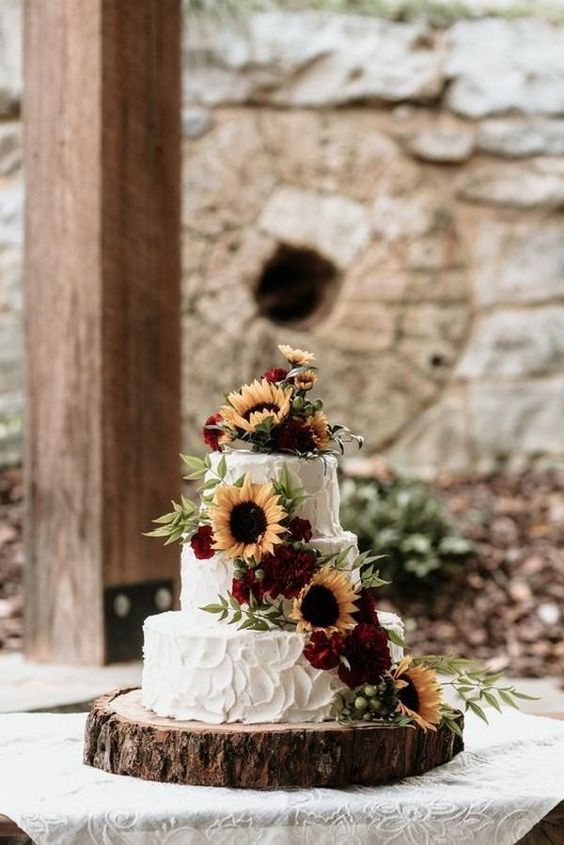 wedding cake topped with sunflowers for 8 awesome sunflower wedding color ideas 2024 maroon