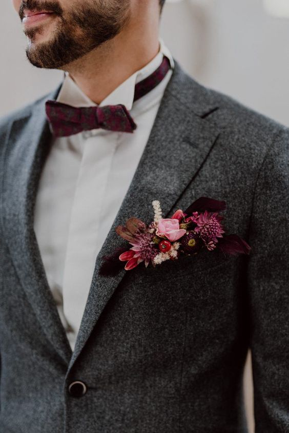 grey mensuit and burgundy boutonniere for 8 winter wedding color ideas 2024 grey platinum burgundy